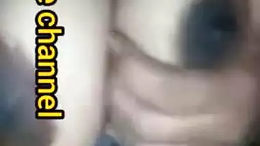 Naughty Desi woman squeezes tits to lick nipples in the porn video
