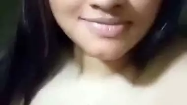 Cute girl opens bra to show sexy boobs to lover