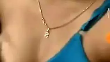 Girl with Indian features takes bra off exposing her boobs in sex show