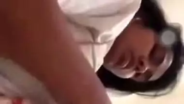 Girl performs XXX show and pulls up white T-shirt to expose boobs