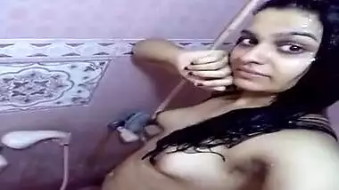 Indian girl expose XXX charms in the shower holding sex camera in hand