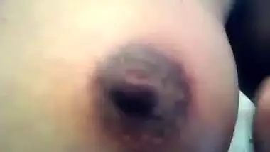 Hot Indian female is home alone so she can expose her boobs for porn
