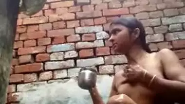 Young desi woman sets the camera on and starts her XXX shower show