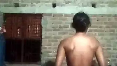 Village girl applying lotion to full nude body